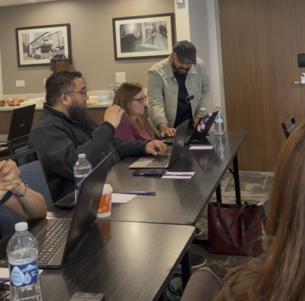 Coaching attendees one-on-one at their laptops