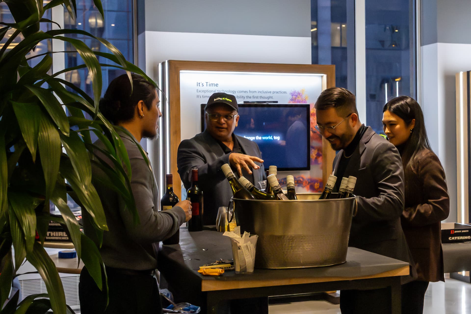 Attendees networking at the wine reception